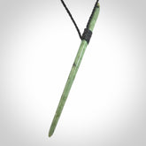 A hand carved New Zealand Jade pendant. The cord and binding is black coloured and is adjustable.
